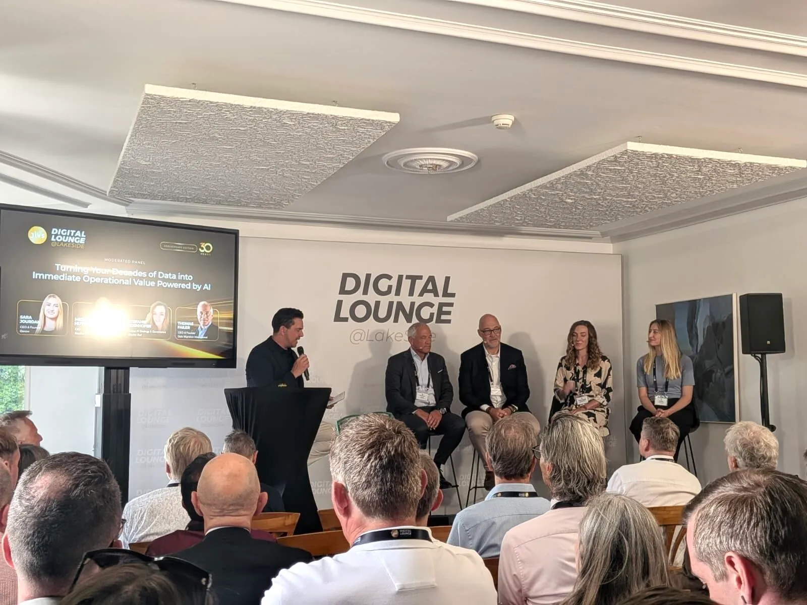 Panel "Turning Your Decades of Data into Immediate Operational Value Powered by AI" at Digital Lounge @Lakeside 2026, with representatives of Genow, Data Migration International and Stadler Rail on stage