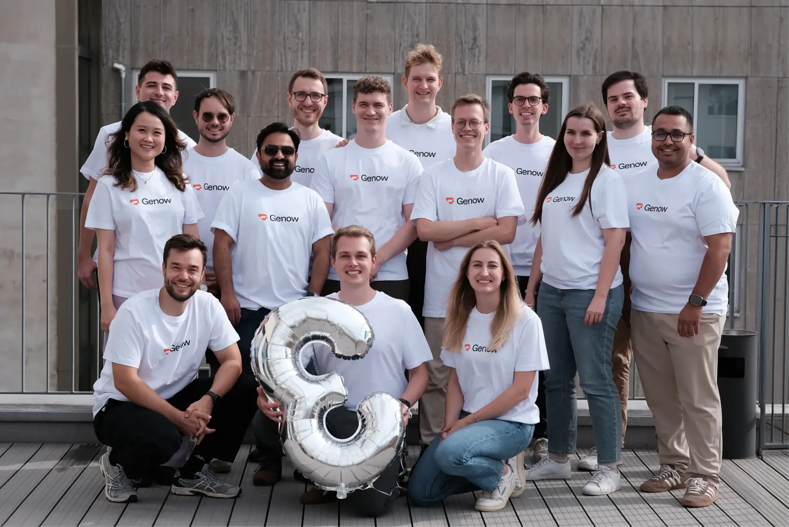 Group photo of the Genow team on the office roof terrace