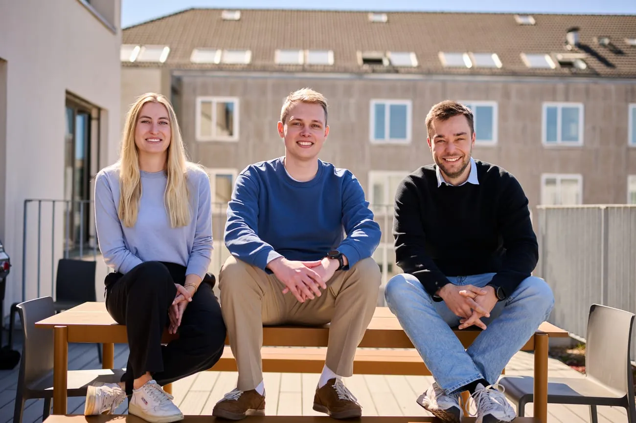 Three members of the Genow founding team on the office roof terrace