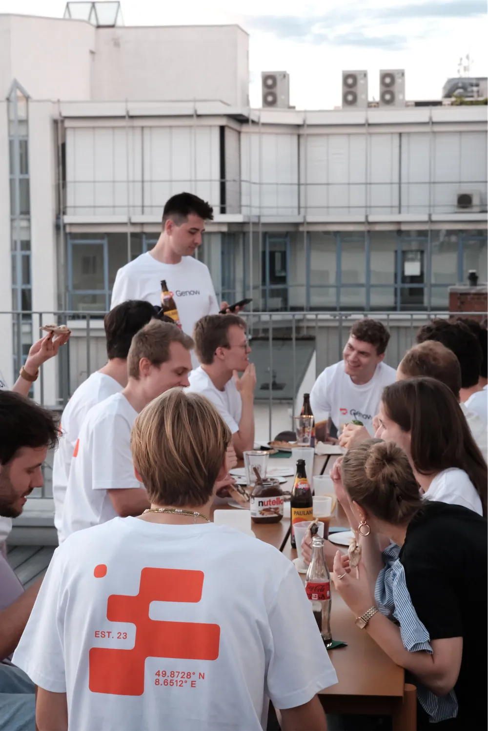 The Genow team having dinner together on the office roof terrace
